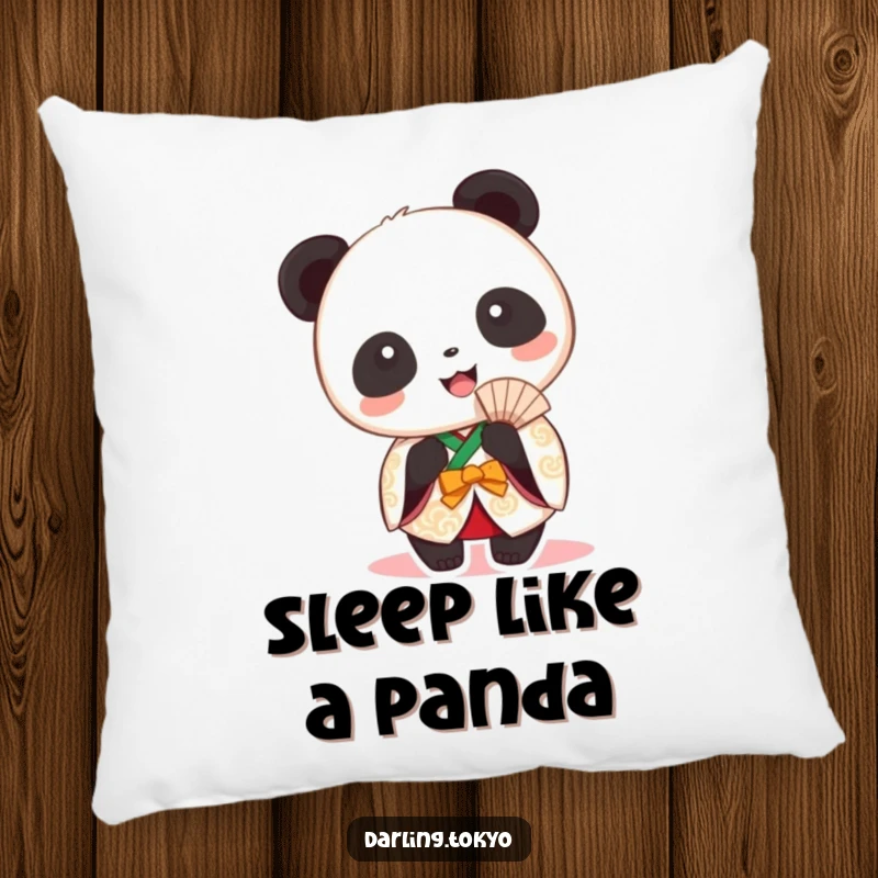 Funny panda in a festive kimono holding a fan on a plush pillow.